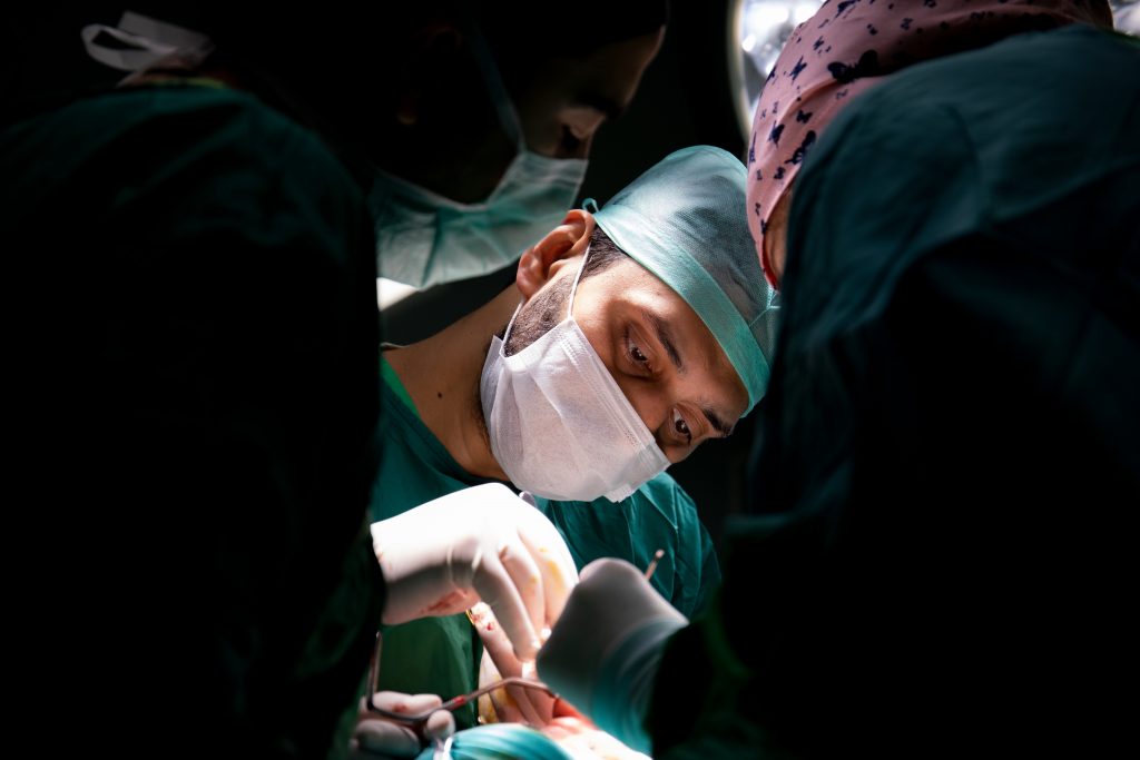 shot focused on a surgeon doing an operation